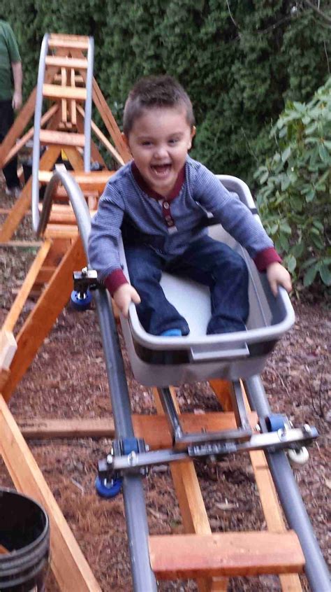 My nephew Keaton is the first to ride my latest backyard roller coaster, the "Little Rocket ...