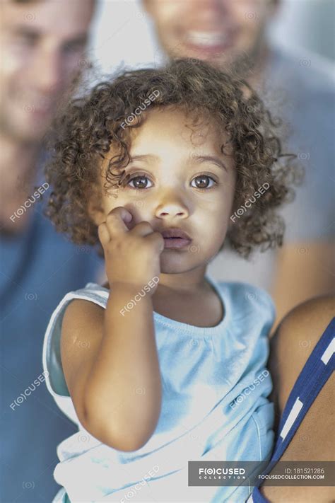 Portrait of little girl with curly hair — innocence, Focus On Foreground - Stock Photo | #181521286