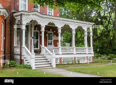 The front porch of a Victorian home in Milford, Pennsylvania, United States, North America ...