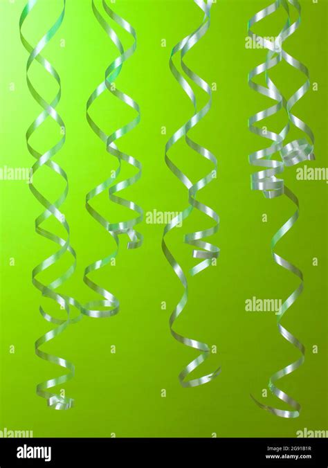 beautiful streamers on green background Stock Photo - Alamy