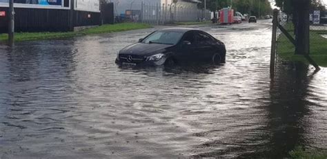 Edinburgh flooding: Watch as cyclist braves deep water, trains are stranded and cars float in ...