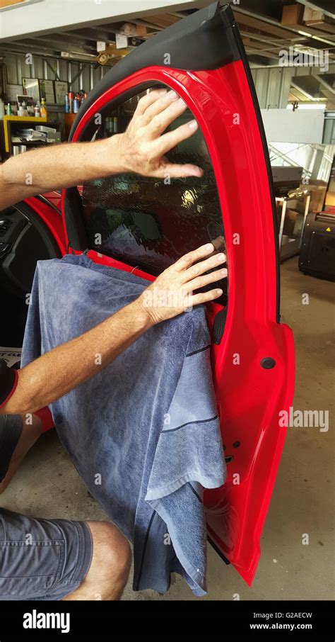 Man tinting a car window hi-res stock photography and images - Alamy