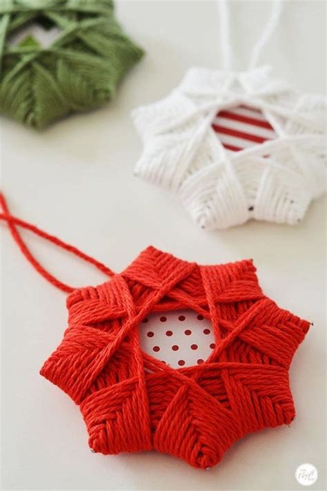 two red and white ornaments sitting on top of a table