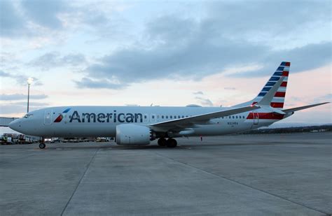 an american airlines plane is parked on the tarmac