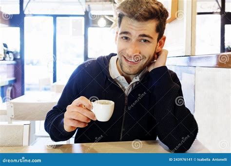 Portrait of a Handsome Barista Sitting with Coffee at the Bar of the Modern Cafe Interior Stock ...