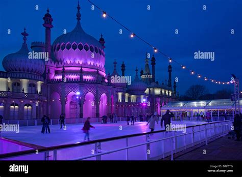 Brighton Royal Pavilion with winter ice skating rink and skaters at ...