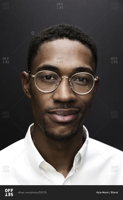 Portrait of smiling Black man wearing eyeglasses stock photo - OFFSET