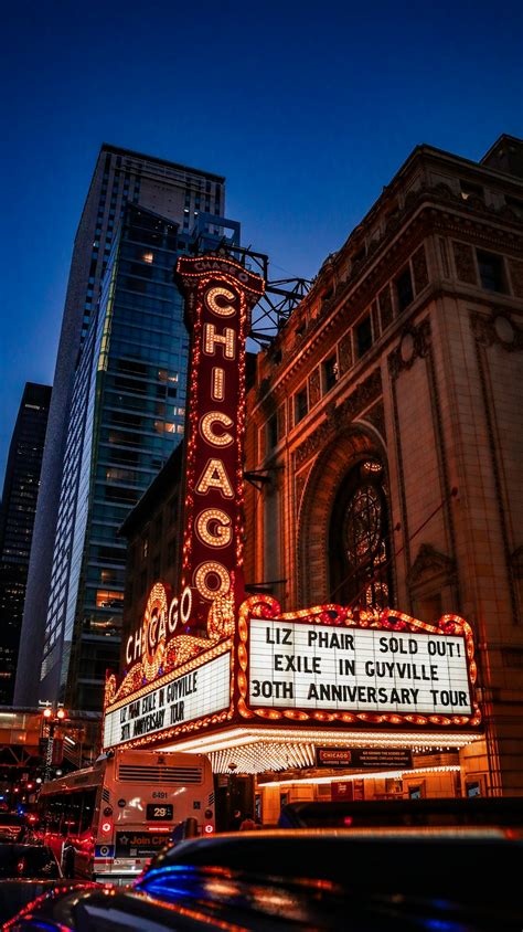 The chicago theater marquee is lit up at night photo – Free Chicago ...