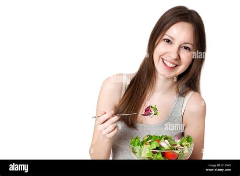 Woman eating salad Stock Photo - Alamy