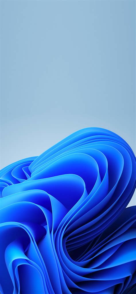 an abstract photo of blue wavy material on a gray background with space ...