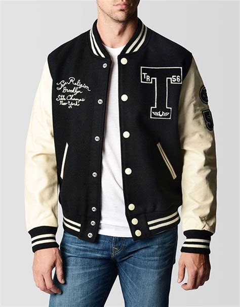 Classic letterman style jacket in black is highlighted by durable wool and genuine leather ...