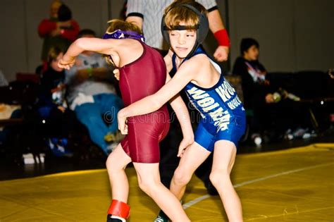 Two Young Boys Wrestling editorial stock image. Image of active - 12328534