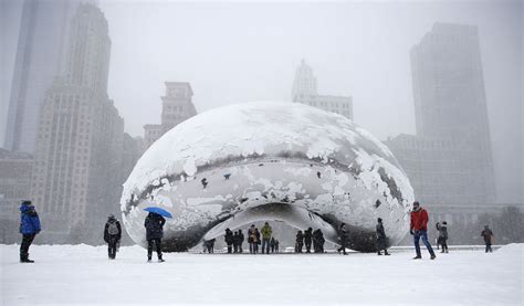 Record-setting snow in Boston and Chicago is a messy winter wonderland