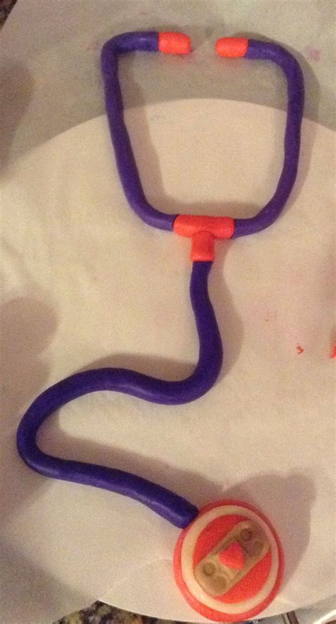 Doc mcstuffins stethoscope made of modeling chocolate | Modeling chocolate, Cupcake birthday ...