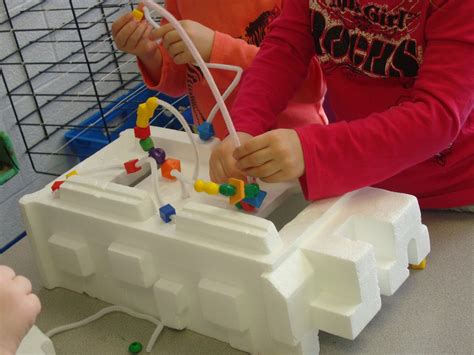 Making bead mazes in preschool