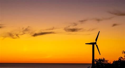 Premium Photo | Wind farm silhouette energy windmills silhouette against the backdrop of a ...