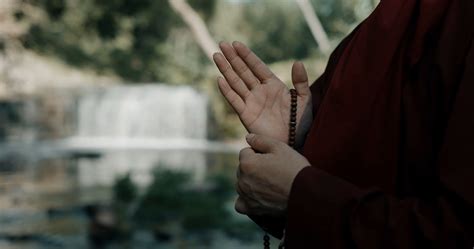 A Monk Praying Outdoors · Free Stock Video