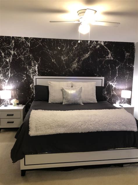 MYW customer Lauren W. gave her bedroom a dramatic accent with this luxurious marble wallp ...