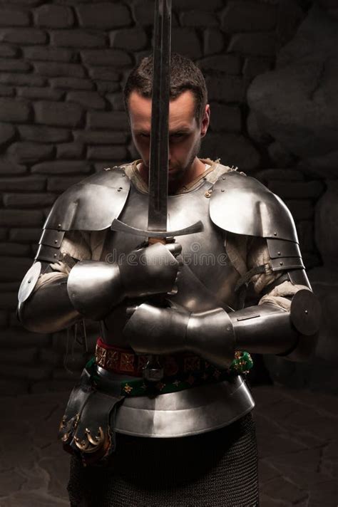 Medieval Knight Kneeling with Sword Stock Image - Image of honor ...