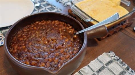 Bacon, navy beans, molasses, brown sugar, and mustard are the key ingredients in this simple ...
