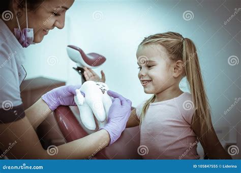 Female Dentist Talking with Little Girl about Hygiene. Stock Image - Image of girls, medical ...