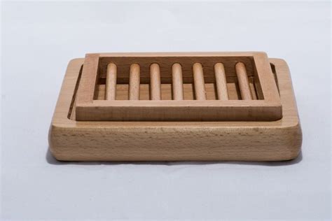 This two-piece wooden soap dish will allow your soaps to drain between uses extending the life ...