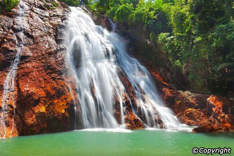 Na Muang Waterfalls, a majestic set of two cascades on Koh Samui, show ...