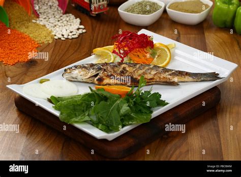 Grilled fish with vegetables Stock Photo - Alamy