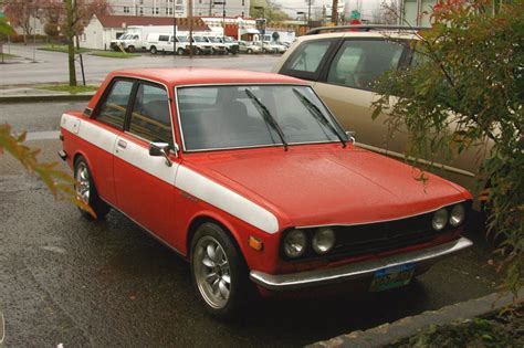 OLD PARKED CARS.: 1971 Datsun 510 Coupe.