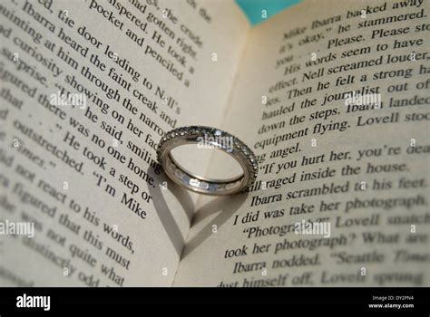 heart shaped shadow in book Stock Photo - Alamy