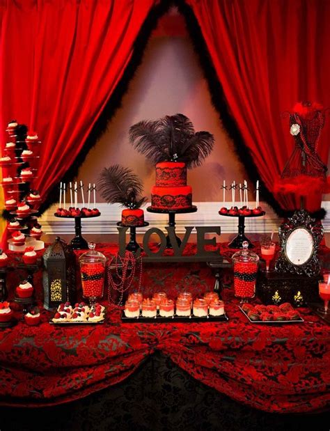 an image of a red and black dessert table