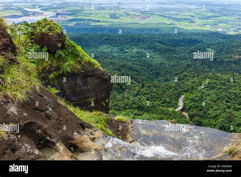 Khasi Hills with waterfalls overlooking the border and plains of Bangladesh at dawn near ...