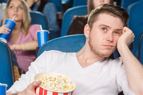 Boring day at the movies stock image. Image of enjoyment - 76227599