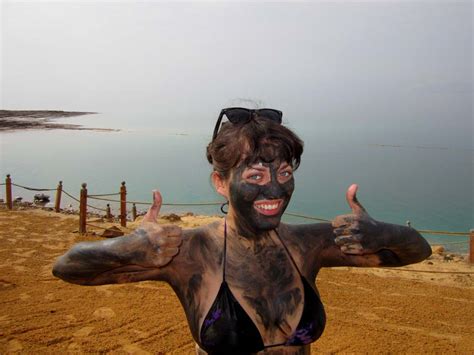 Floating in the Dead Sea in Jordan - Adventurous Kate