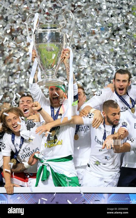 Real Madrid's Sergio Ramos lifts the UEFA Champions League trophy after ...