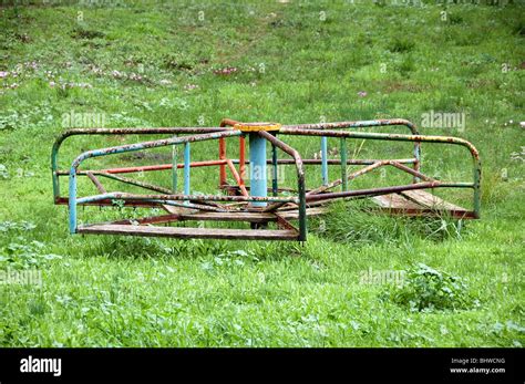 Vintage rusty merry-go-round. Abandoned playground Stock Photo - Alamy