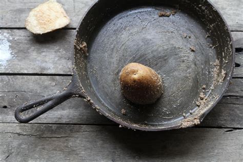 an old frying pan with a piece of bread in it