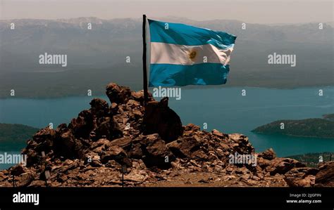 Argentine flag. In the background, Nahuel Huapi lake (765 m) covered in ...