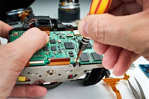 Repair broken photo DSLR camera in service Stock Photo by ©ryzhov 135142056