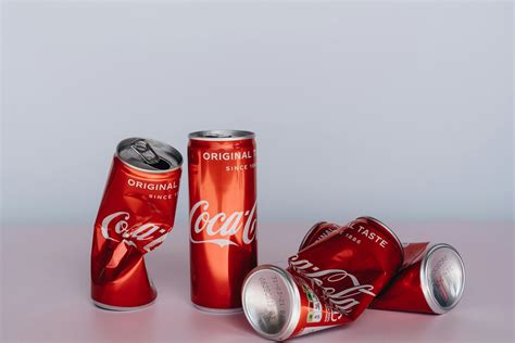 Coca Cola Can on White Table · Free Stock Photo