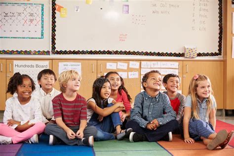 Elementary School Kids Sitting on Classroom Floor Stock Photo - Image of horizontal, american ...