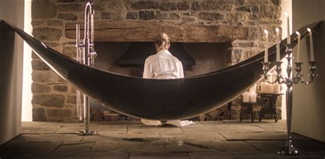 The suspended hammock bath, made of carbon fibre. The sculptural ...