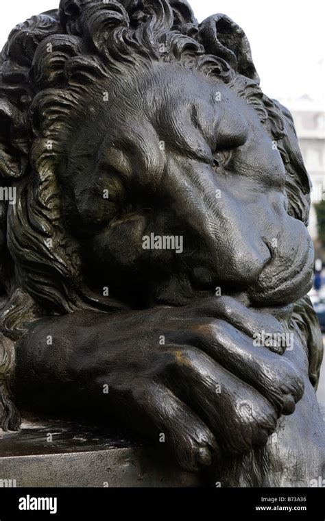 Sleeping lion statue Stock Photo - Alamy