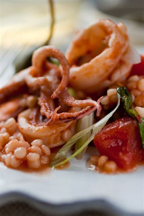 Spicy Calamari With Tomato, Caperberries and Pine Nuts Recipe - NYT Cooking