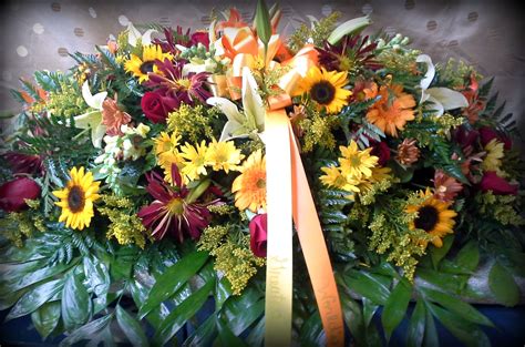 Gorgeous casket spray with sunflowers and shades of fall | Casket sprays, Floral arrangements ...