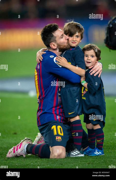 Lionel Messi of FC Barcelona kisses his son Thiago to celebrate after his team defeated Levante ...