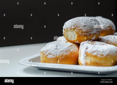 Berliner Pfannkuchen, a German donut, traditional yeast dough deep fried filled with chocolate ...