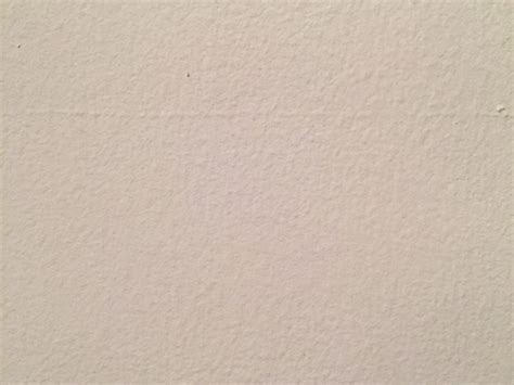 Off white painted concrete wall w/ bumps | Free Textures