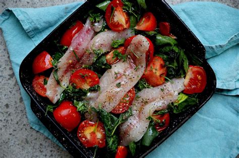 baked Gurnard on a bed of spinach and home grown tomatoes. I drizzled well with extra virgin ...