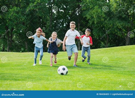 Happy Multiethnic Kids Playing Soccer with Ball in Park Stock Image - Image of friendship ...